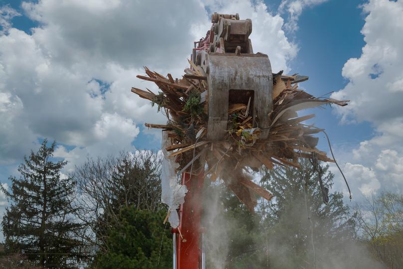 Demolition contractor demolishing a building