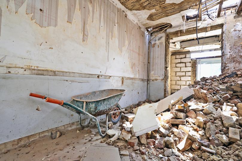 Demolition contractor demolishing a building