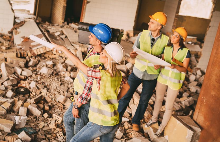 Demolition contractor demolishing a building