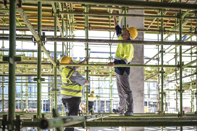 Construction workers building a new house