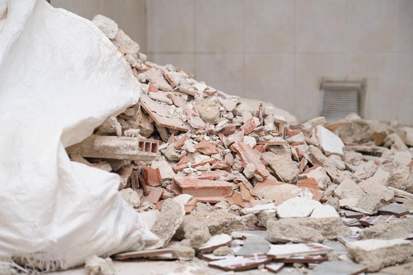 Demolition contractor demolishing a building