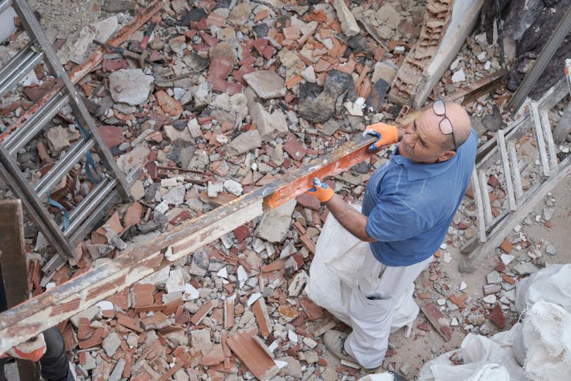 Demolition contractor demolishing a building