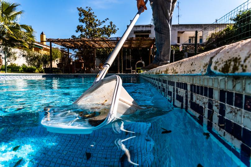 Pool removal contractor demolishing an inground pool