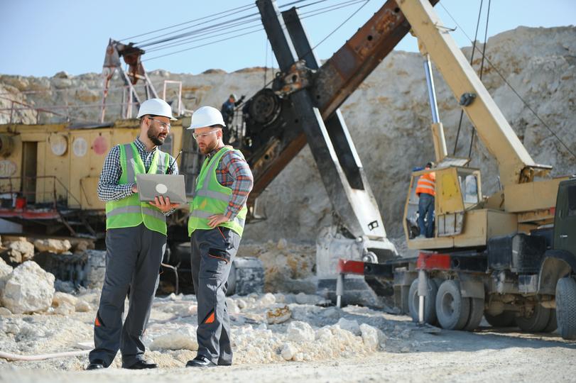 Excavation contractor operating an excavator on a construction site